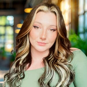 Professional headshot of Jillian Glover, MA, LPC, specializing in performance psychology, anxiety, perfectionism, parenting, work-life balance, depression, aging, CBT, and mindfulness.